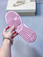 Close view of the pink textured rubber outsole with circular and rectangular tread sections; image text shows style code 2607GDD115A15 and size range 35–45.