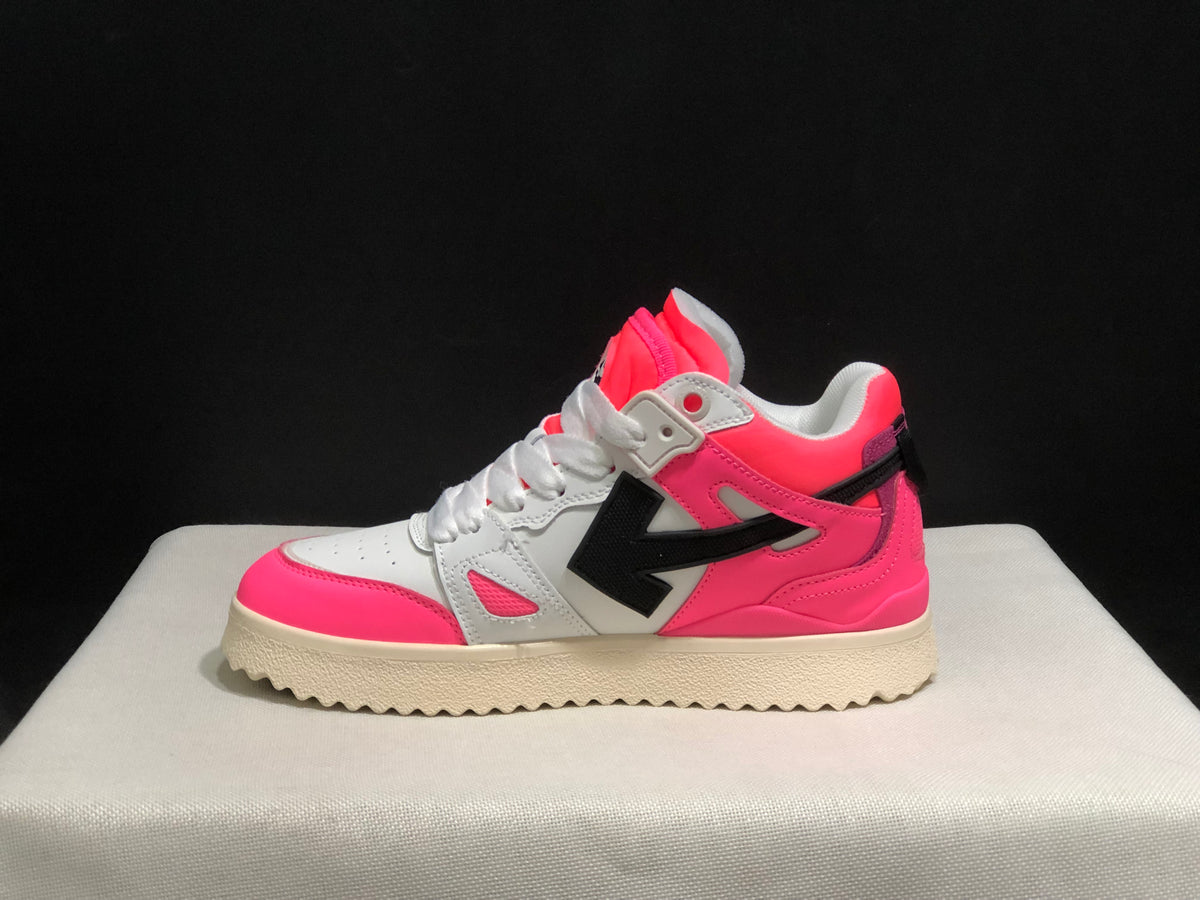 Lateral side profile showing the pink and white upper, black arrow motif, white laces, and textured cream outsole.