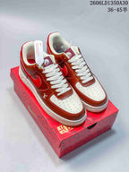 Three pictured sneaker colorways shown from the side, including brown and red, cream and burgundy, and navy and orange.