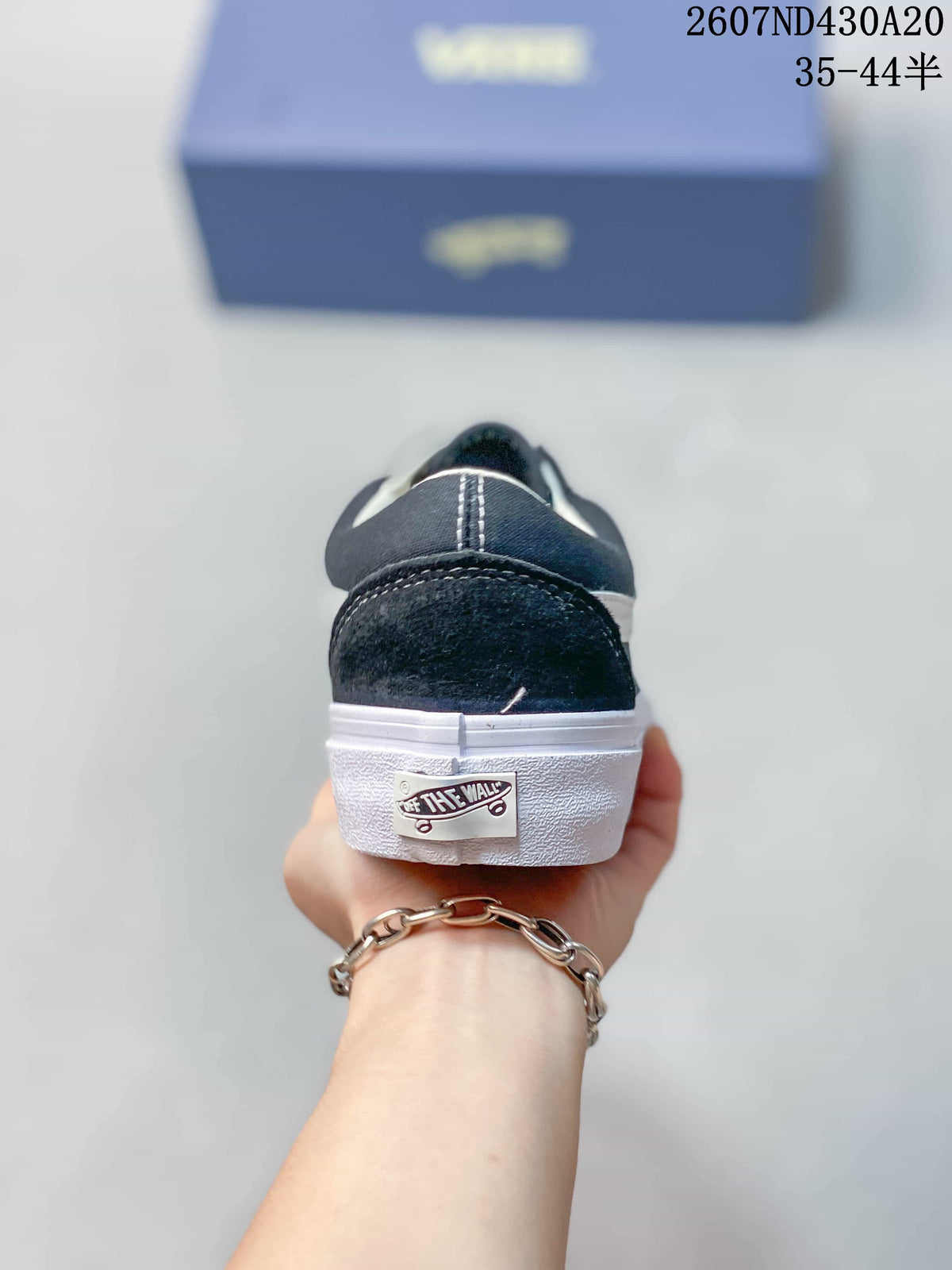 Rear view of the sneaker showing the heel stitching, white sole, and Vans heel label.