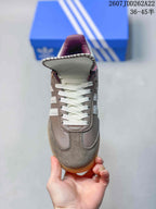 Top view showing the white laces, stitched panels, and burgundy tongue detail.