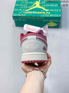 Rear view showing burgundy heel panels and embroidered details on an Air Jordan 1 Low