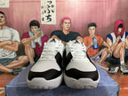 Front view showing the laces and black toe overlays on white basketball shoes