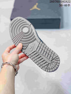 Close view of the sneaker outsole showing a circular traction pattern, textured tread, and Jordan branding.