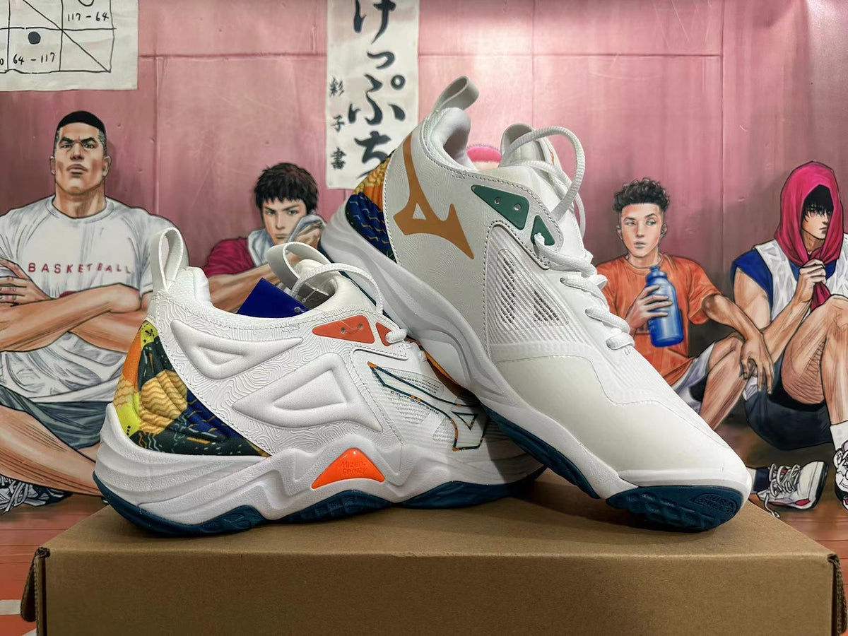 Angled view of Mizuno Wave Momentum 3 shoes showing white uppers, orange and green details, and multicolor heel panels.