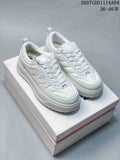 Pair of white Moncler Trailgrip GTX sneakers displayed on a shoebox, with the style code and size range shown at the top right.