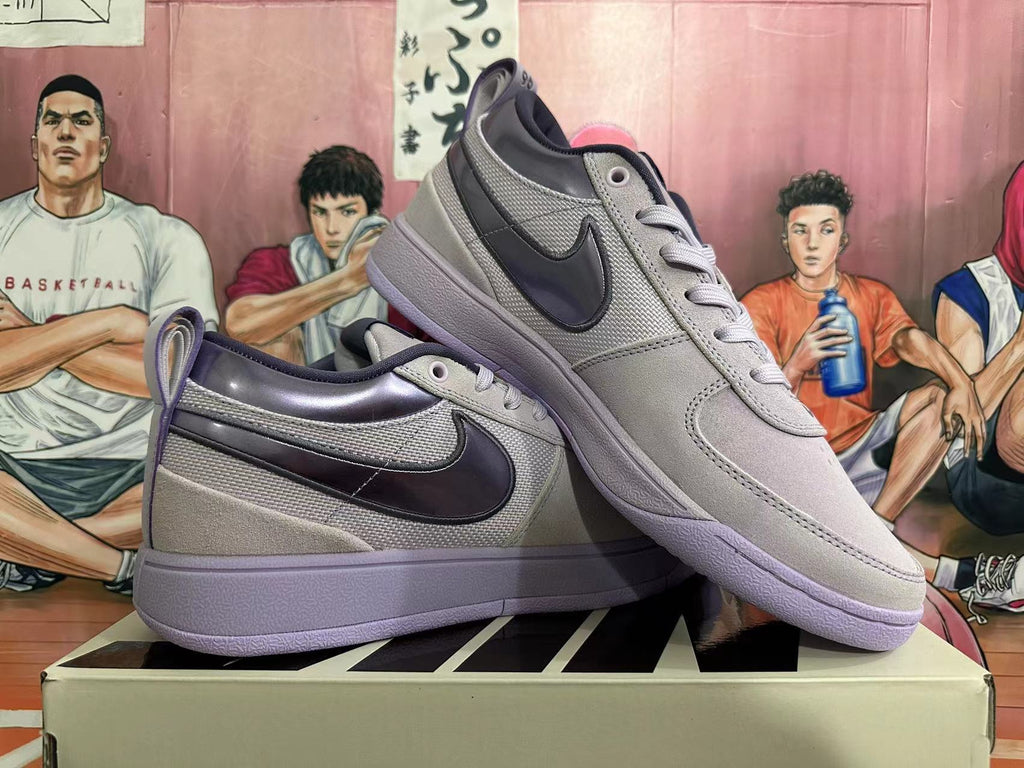 Two gray and purple low-top sneakers shown from the side
