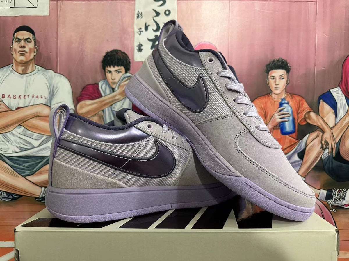 Two gray and purple low-top sneakers shown from the side