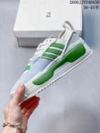 Side profile of a Y-3 Rivalry sneaker showing green accents and layered panels