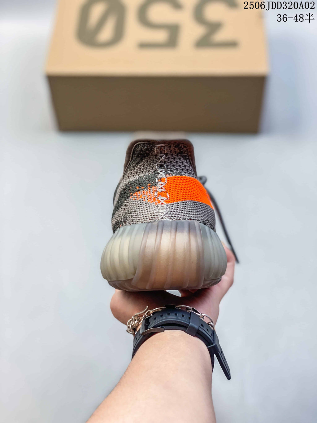 Rear view showing the gray heel, orange side detail, and translucent ribbed sole.