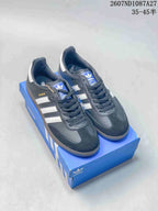Pair of black and white adidas Samba sneakers displayed on a blue shoebox, with the style code and 35–45 size range visible above.