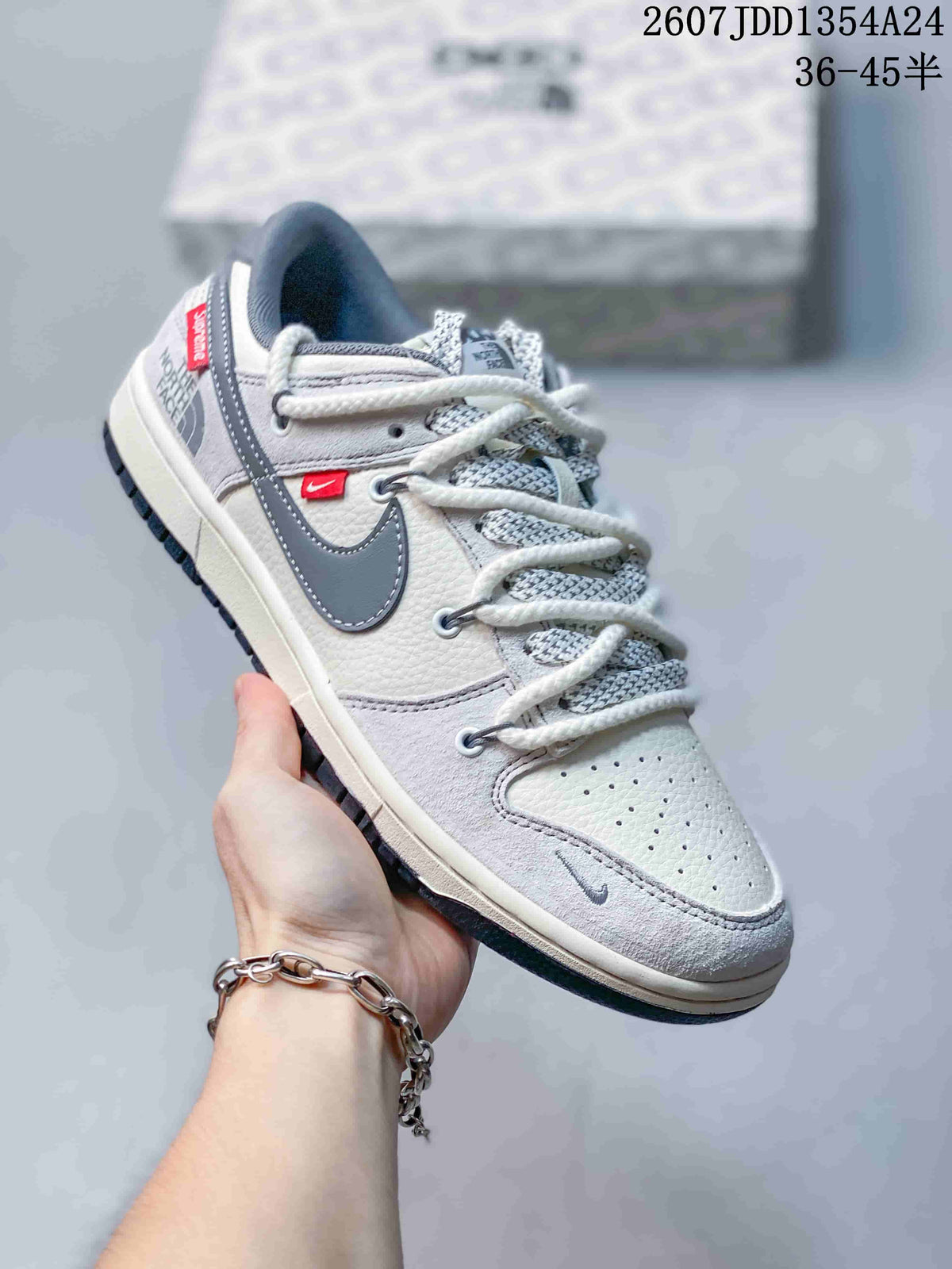 Angled side view showing the low-top silhouette, contrasting Swoosh, perforated toe box, and dark outsole.