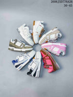 Several low-top sneakers arranged in a circle to show multiple color combinations