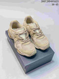 Pair of beige and cream Onitsuka Tiger TIGRUN sneakers displayed on a shoe box, with the source-listed code and size range visible above.