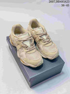 Pair of beige and cream Onitsuka Tiger TIGRUN sneakers displayed on a shoe box, with the source-listed code and size range visible above.