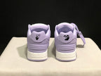 Rear view showing lavender heel panels, padded collars, and graphic heel details.