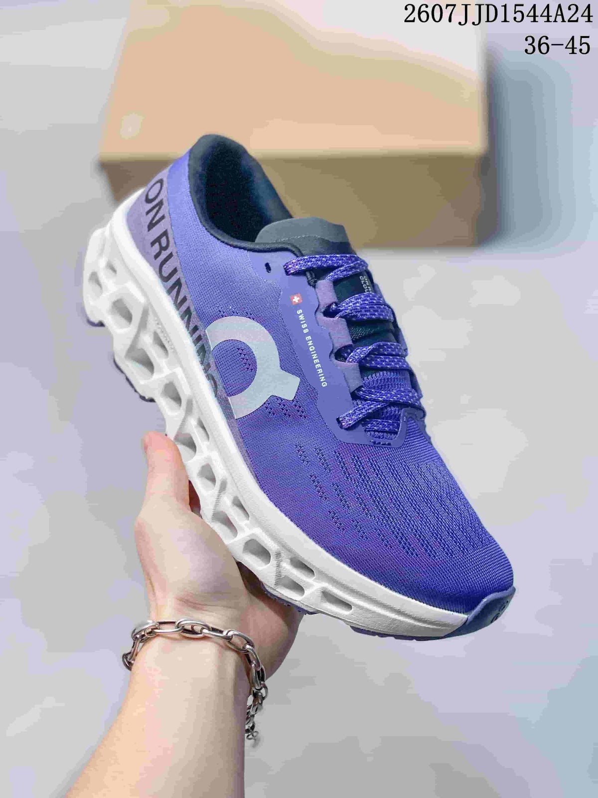 Angled side view of the purple running shoe showing the On logo, heel lettering, lace-up upper, and white midsole.