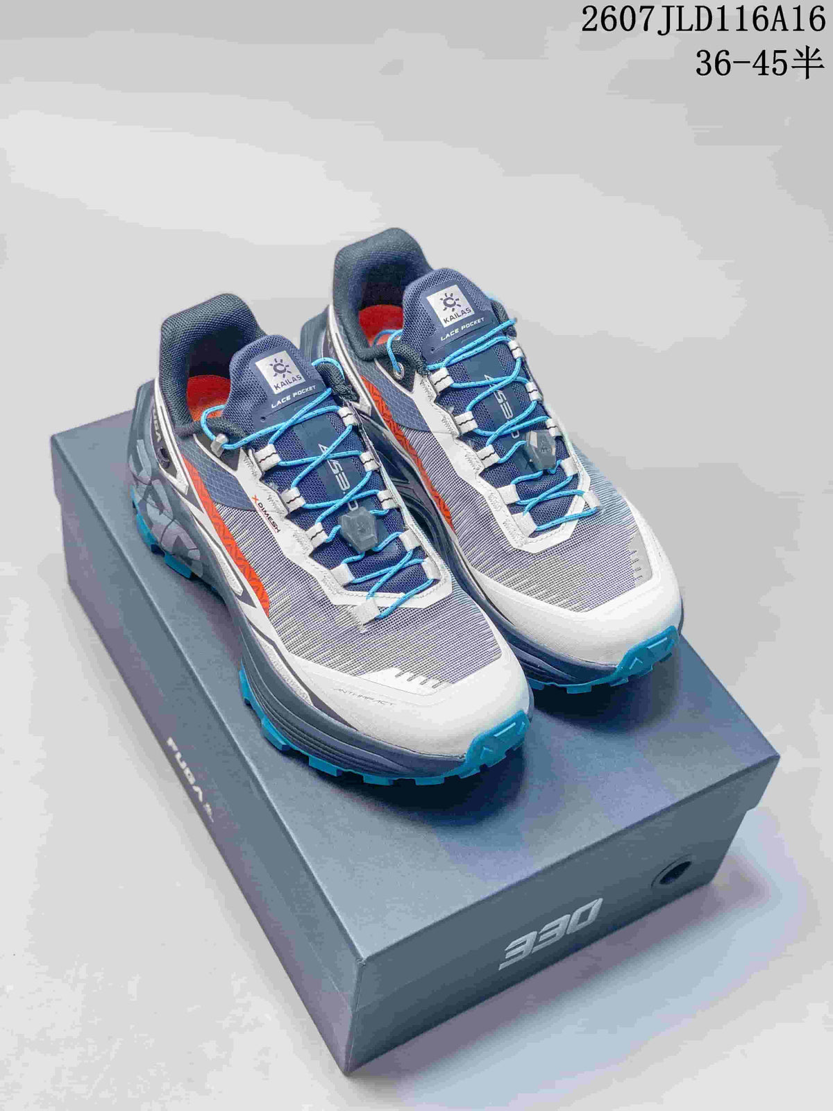 Pair of KAILAS FUGA EX330 trail shoes in blue, gray, white, and orange displayed on an EX330 shoebox; visible text includes style code 2607JLD116A16 and size range 36–45.5.