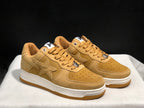 Three-quarter front view of the wheat Bape Sta pair with tonal star panels and contrasting white midsoles.