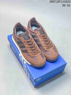 Pair of brown adidas SL 72 sneakers displayed on a blue adidas shoebox, with style code 2607JDY113A23 and size range 36–45 visible above.