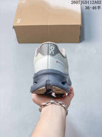 Rear view of the sneaker with a gray sculpted sole
