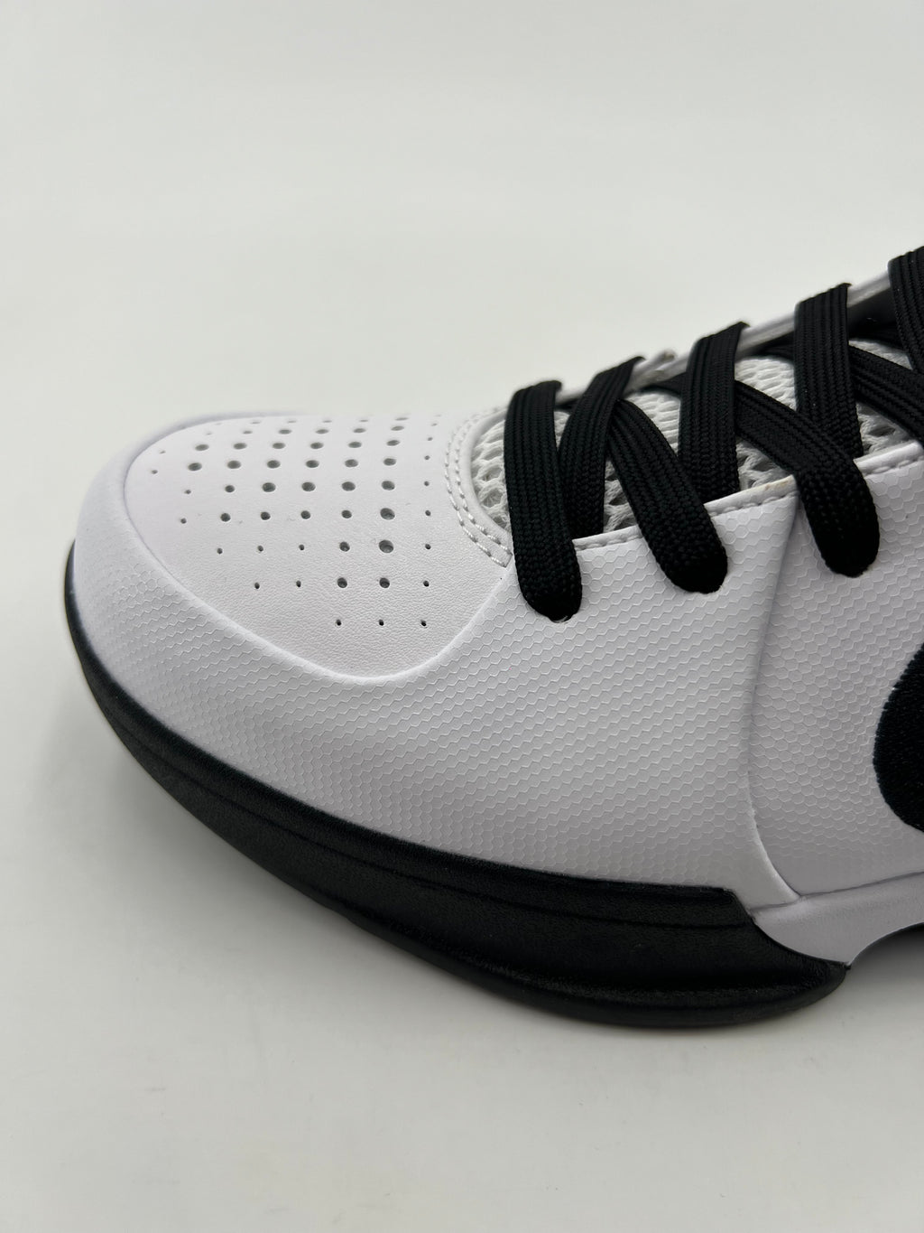 Close-up of the perforated toe and black laces
