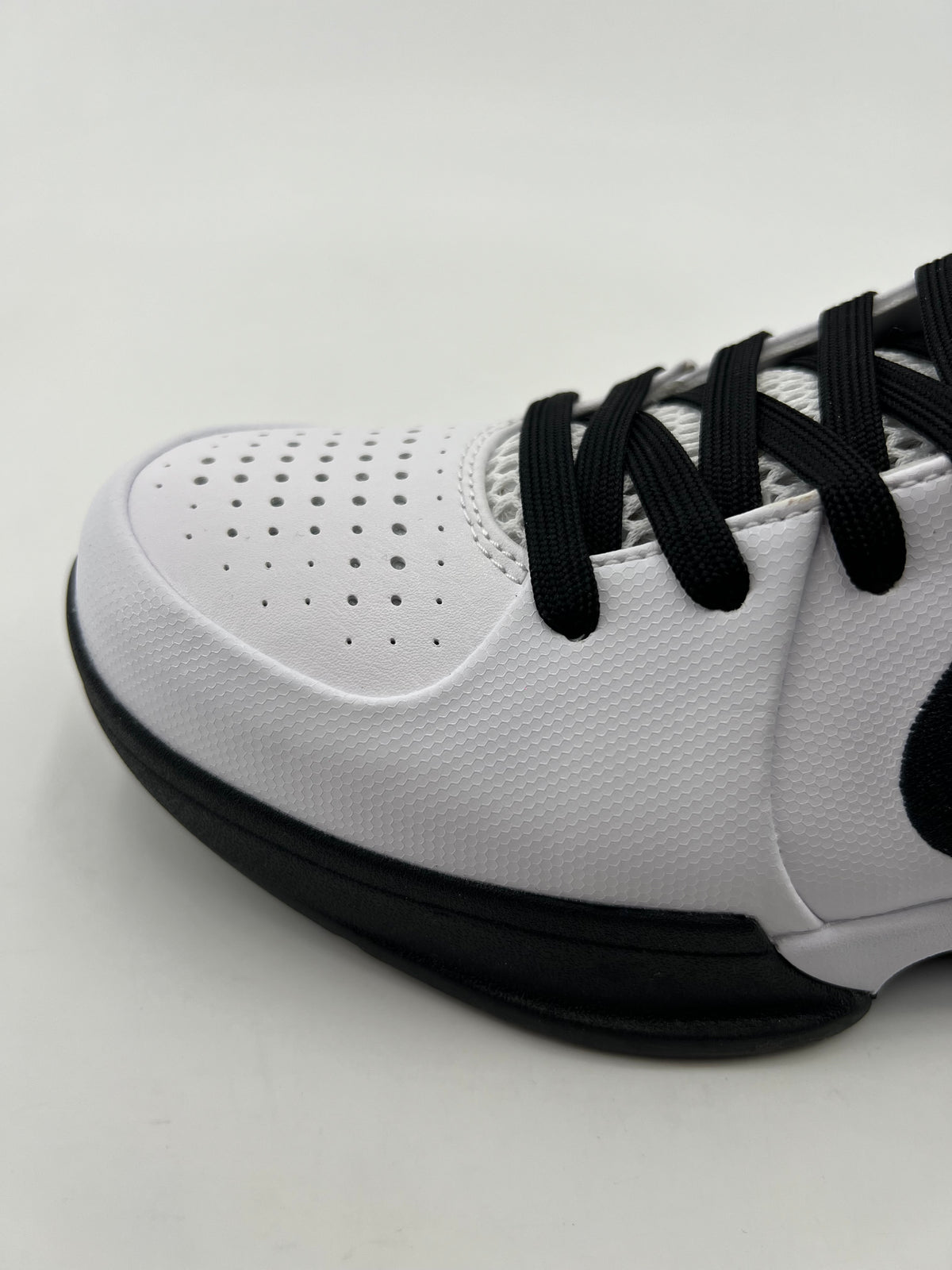 Close-up of the perforated toe and black laces