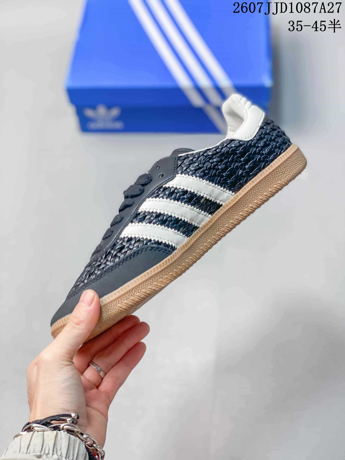 Side view of the sneaker showing the white three-stripe detailing, dark navy upper, low-top profile, and gum-colored outsole.