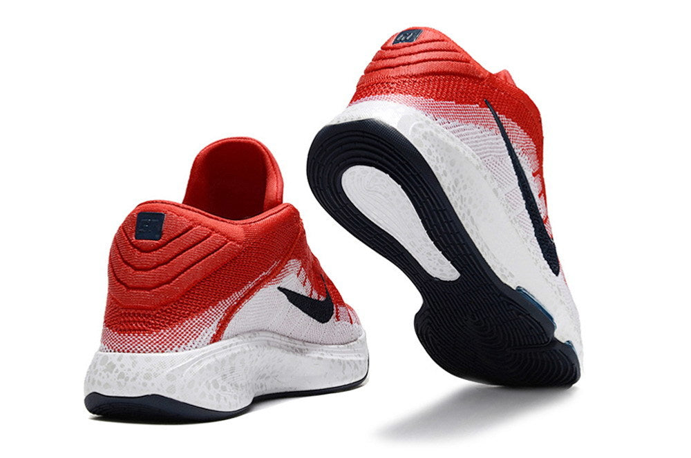 Red and white Nike GT Hustle 3 shoes shown from the heel and outsole.