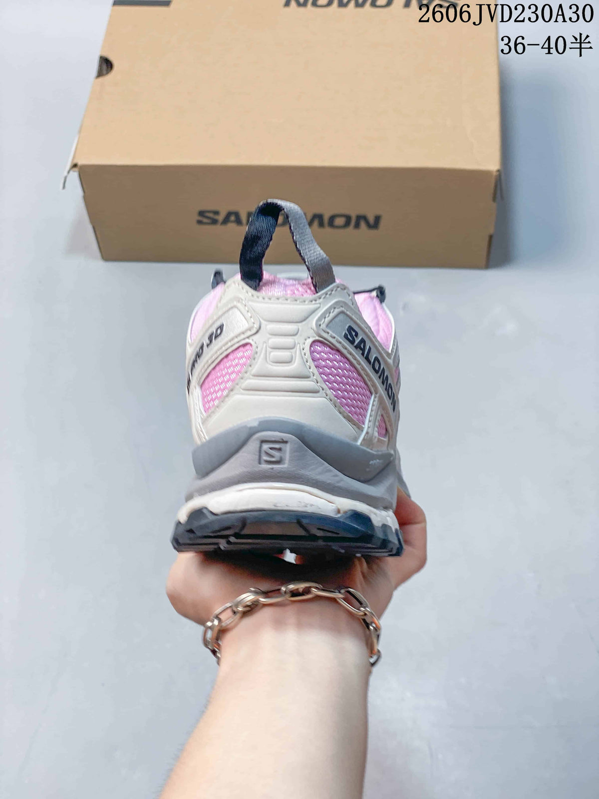 Rear view of the pink and gray Salomon XA Pro 3D shoe