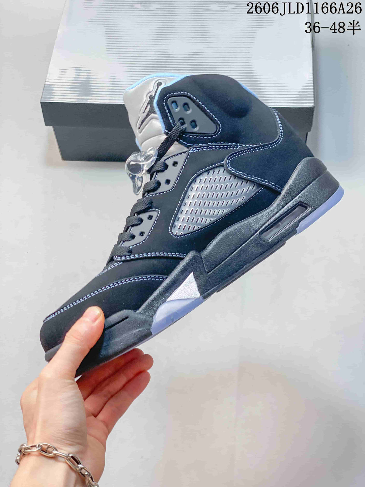 Side view highlighting the dark upper, mesh side panel, contrast stitching, and translucent outsole accents.