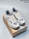 Pair of white and gray On Cloudtilt Remix sneakers displayed on a shoe box.