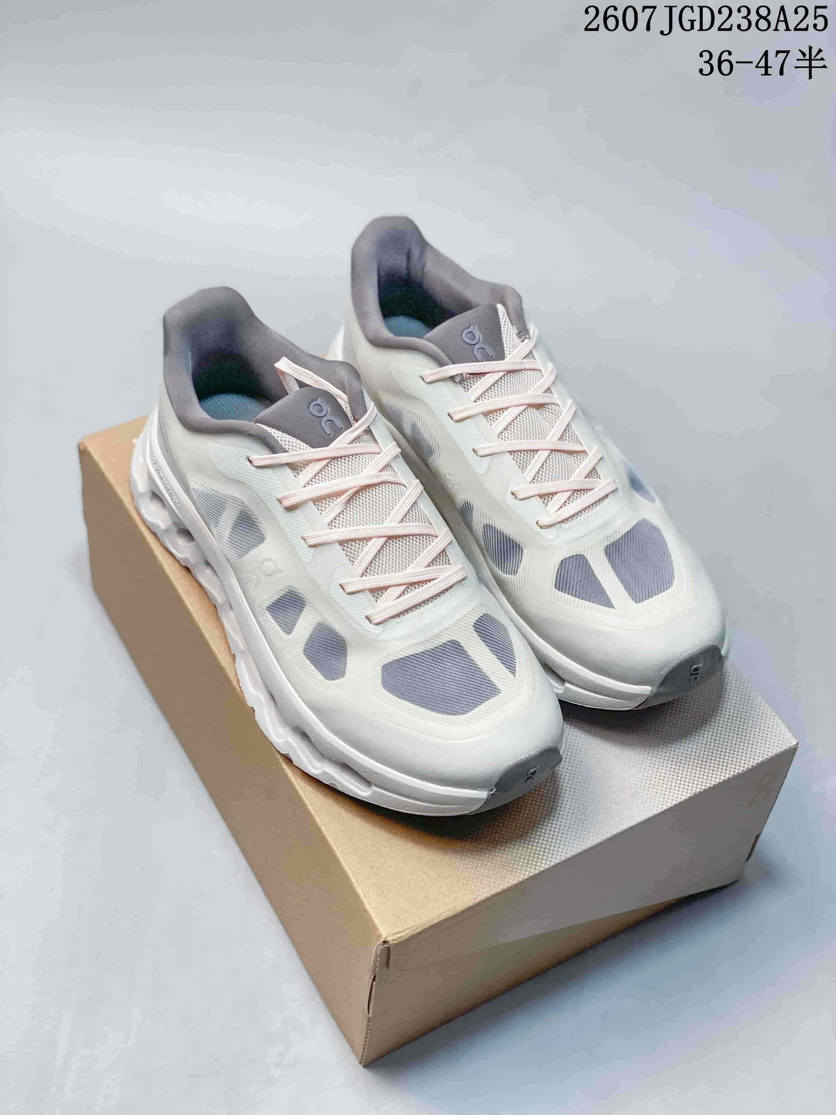 Pair of white and gray On Cloudtilt Remix sneakers displayed on a shoe box.