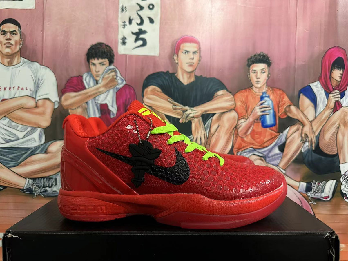 Side view of a red basketball sneaker with a black Swoosh and textured upper