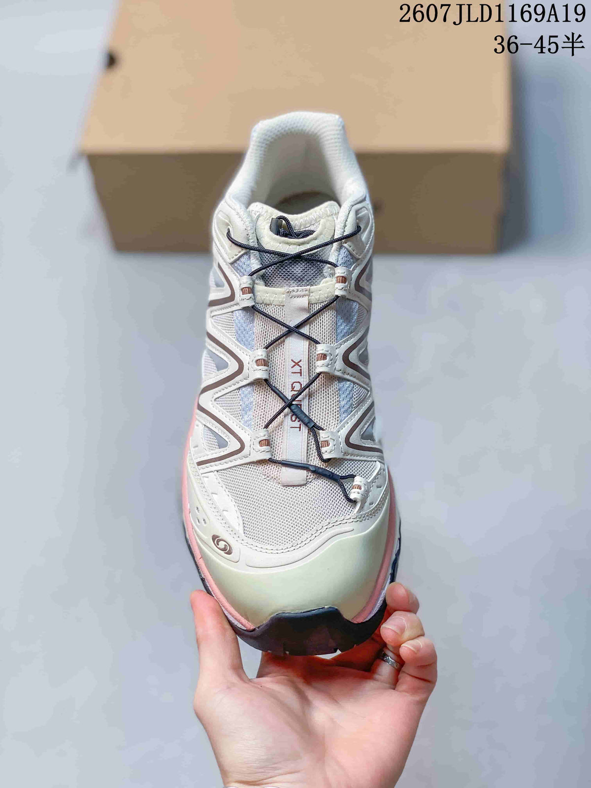 Top view of a Salomon XT-Quest sneaker showing the light-colored upper and cord-style lacing.
