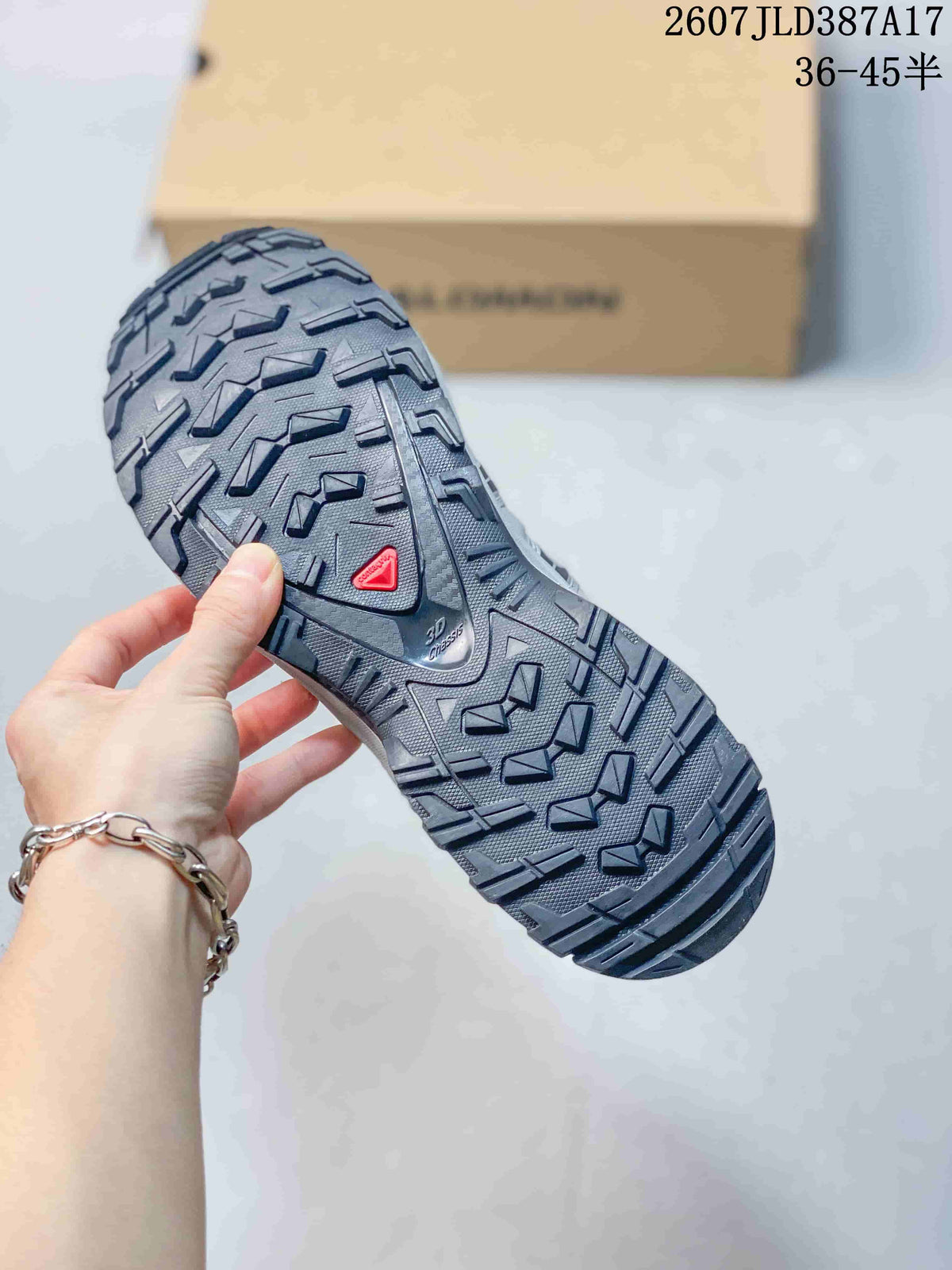 Close view of the Salomon XA Pro 3D outsole showing a dark lugged tread pattern, red Salomon detail, and Contagrip branding.