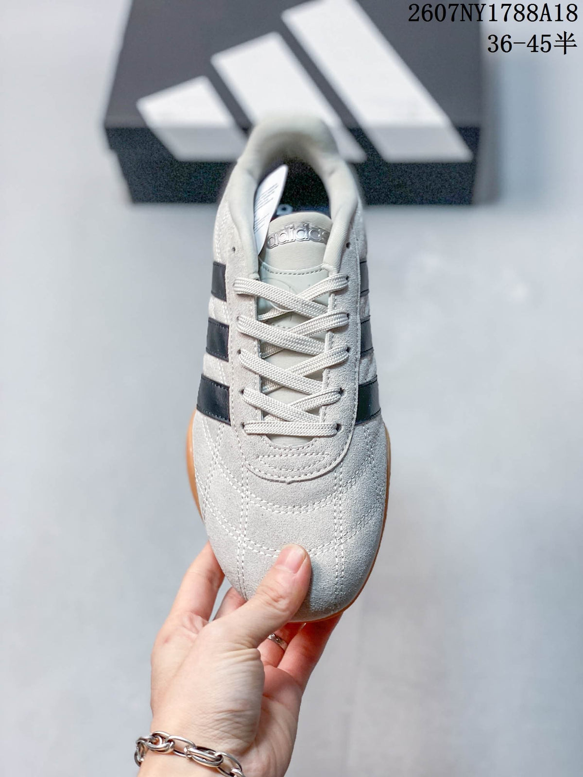 Top view showing the rounded toe, tonal laces, stitched panels and adidas tongue branding.