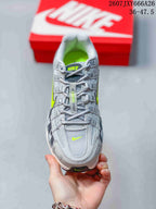 Top view of the sneaker showing the lace-up layout, layered toe box, and volt accents.