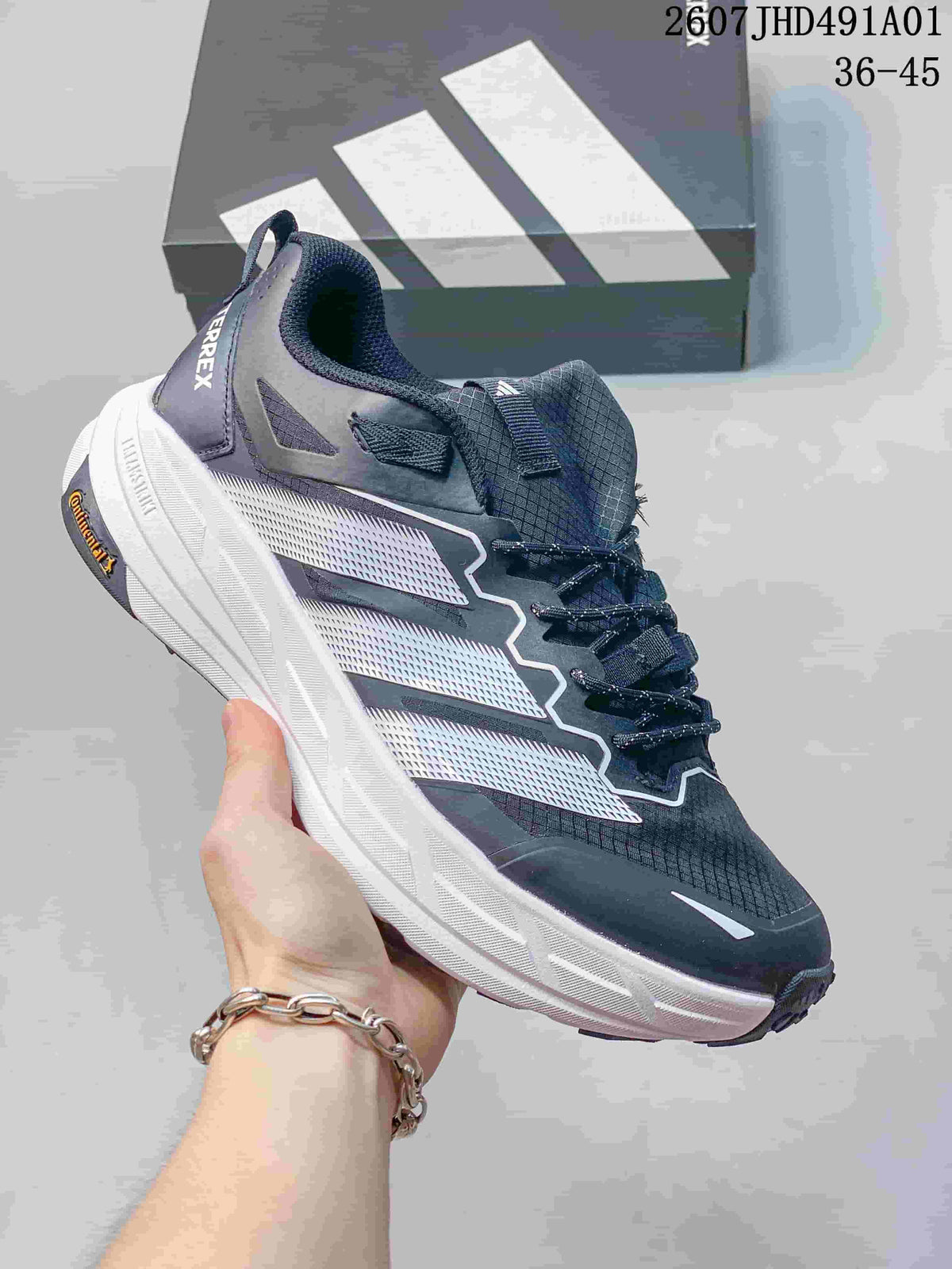 Dark gray Adidas Terrex low-top shoe with a light-colored sole; image also displays the size range 36–45.