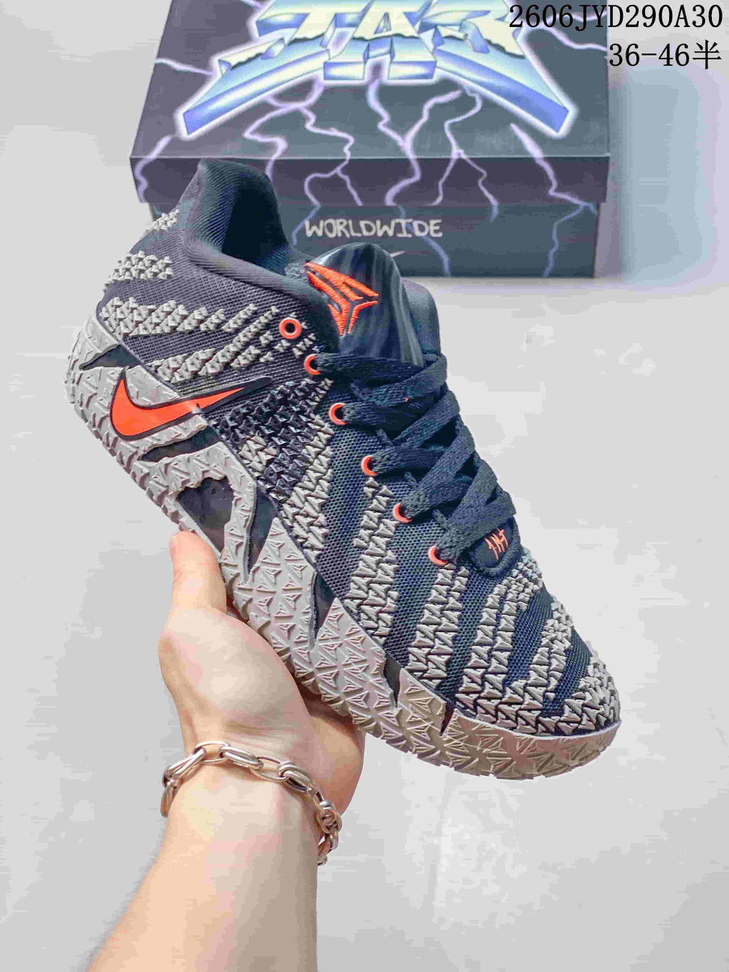 Dark gray Nike Ja 3 basketball shoe with orange accents