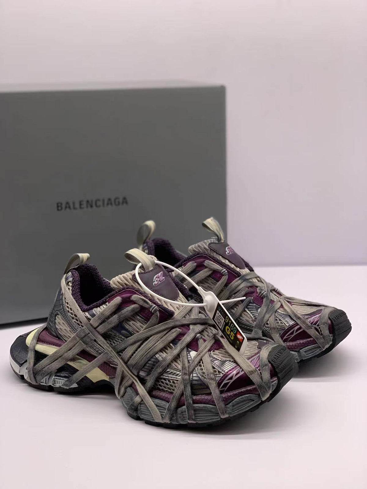 Pair of gray and purple 3XL sneakers shown from a three-quarter front angle.