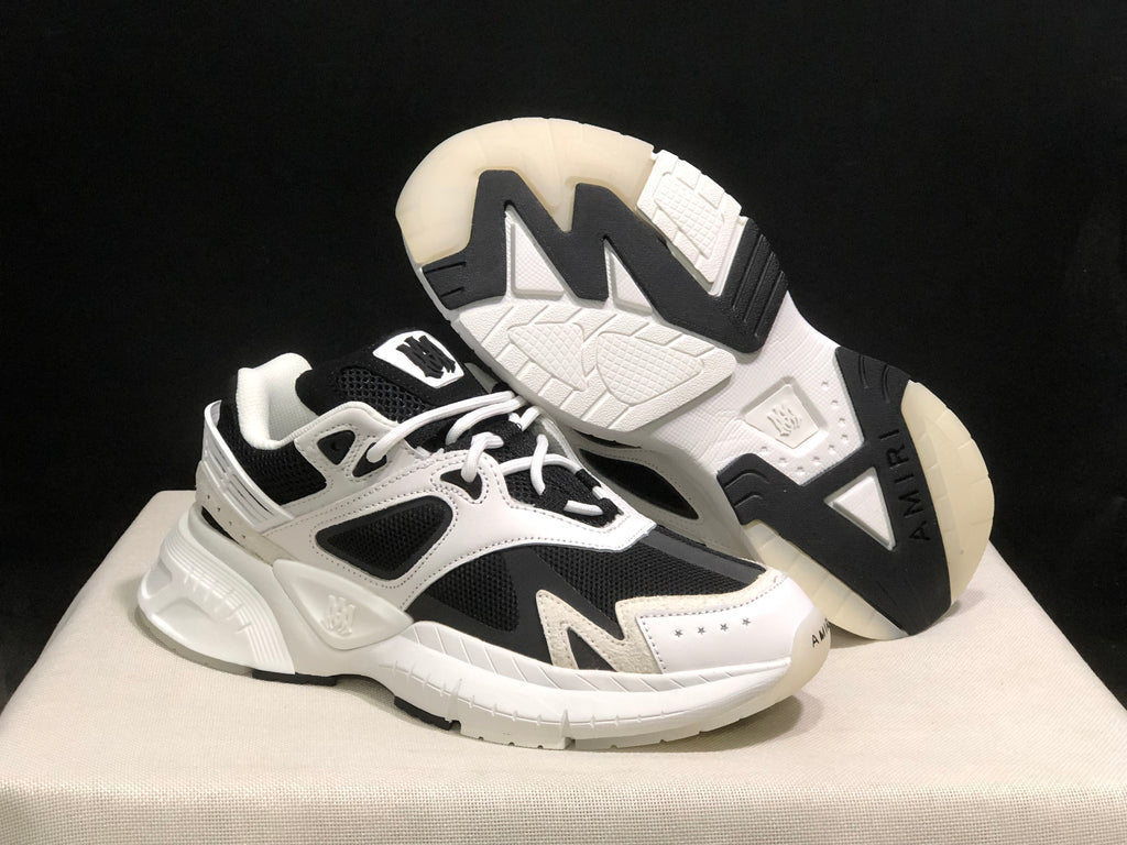 Angled view showing the outsole tread, contrasting black sections and white upper.