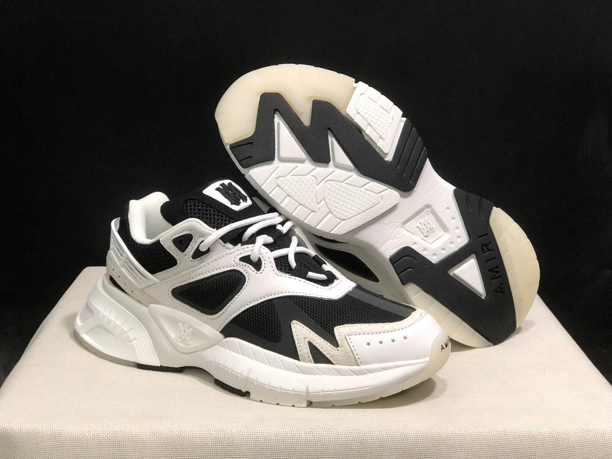 Angled view showing the outsole tread, contrasting black sections and white upper.