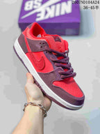 Close-up side view of a red and dark brown low-top sneaker with a Nike Swoosh.
