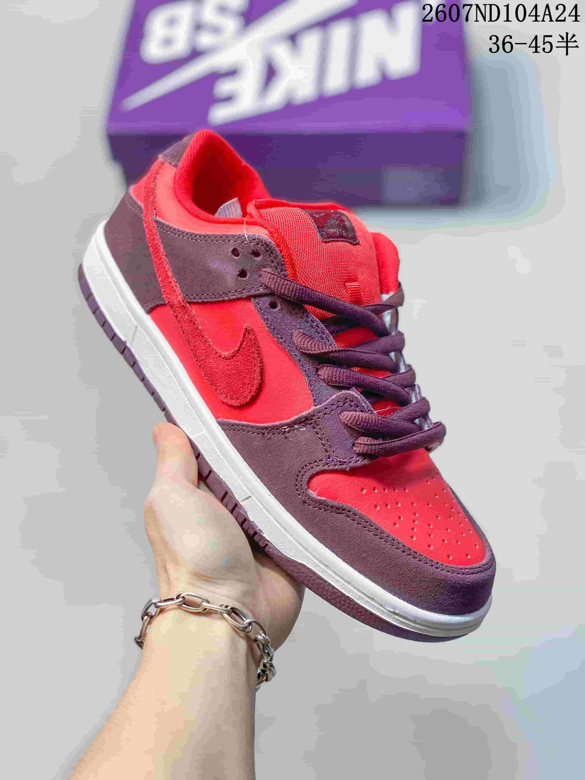 Close-up side view of a red and dark brown low-top sneaker with a Nike Swoosh.
