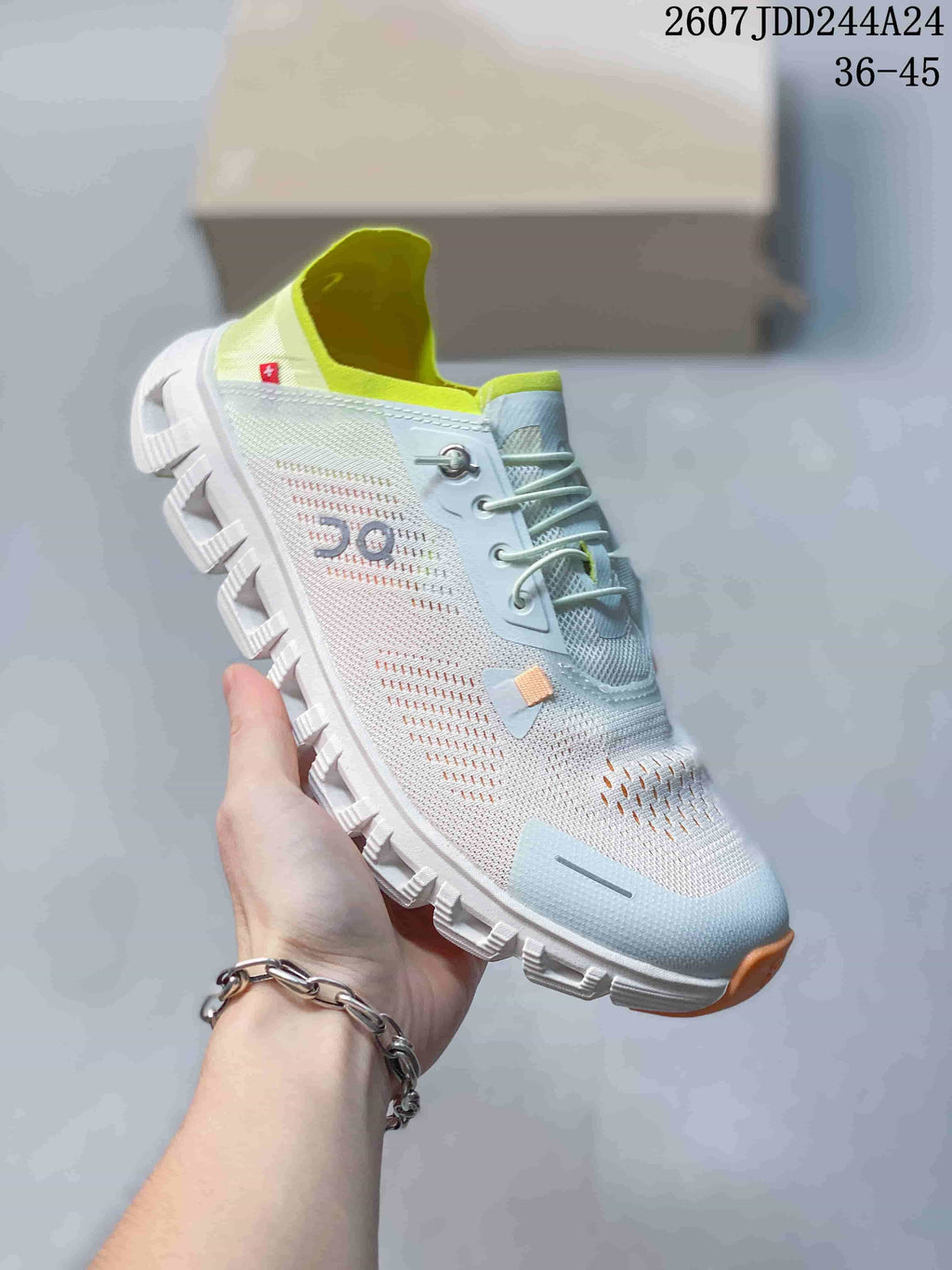 Angled side view of the pale blue and white lace-up sneaker showing its low-top shape, perforated upper, and segmented outsole.
