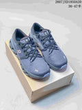 Dark gray On Cloud X 4 sneakers shown as a pair on a shoebox.