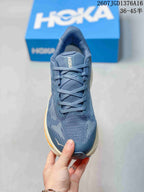 Top view of the blue shoe showing the mesh-like upper, tongue and lace arrangement.