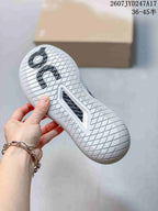 Underside of the sneaker showing a patterned white rubber outsole and On branding.