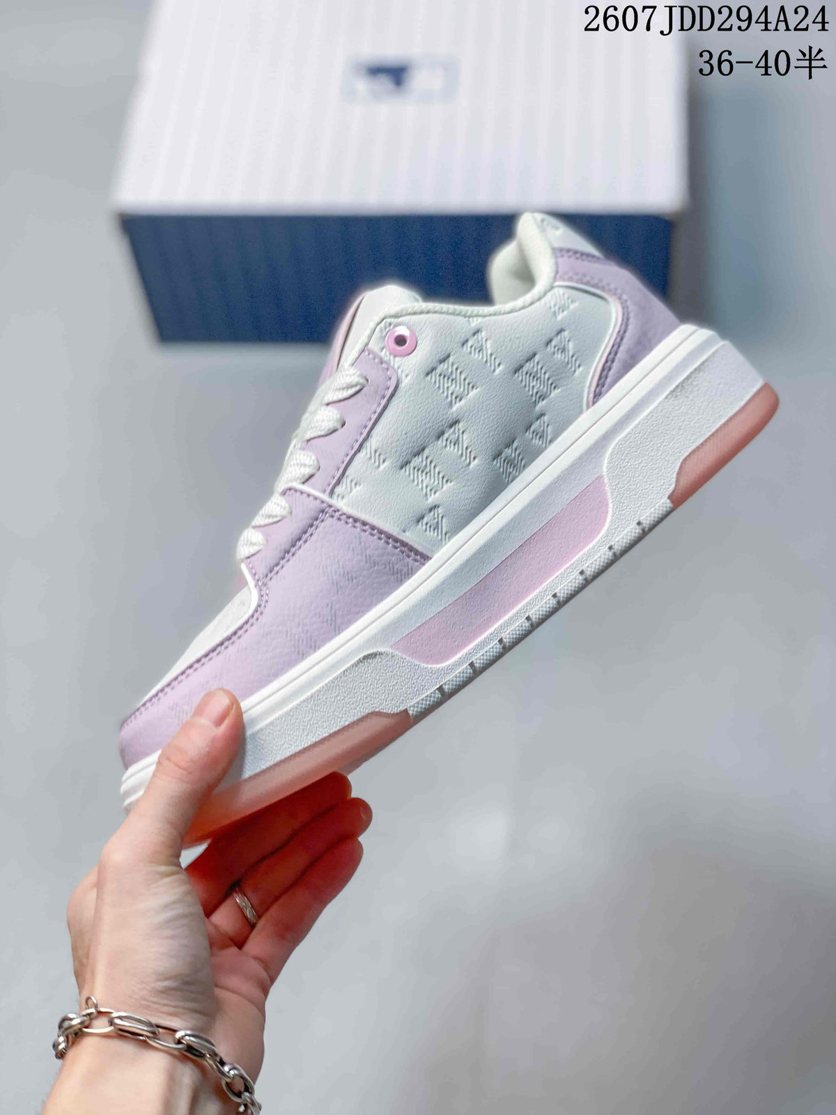 Side view highlighting the lavender and white upper, embossed patterned panels, side logo, and layered platform-style sole.